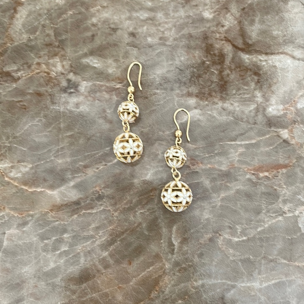 Gold tone and enamel flowered design hanging earrings.